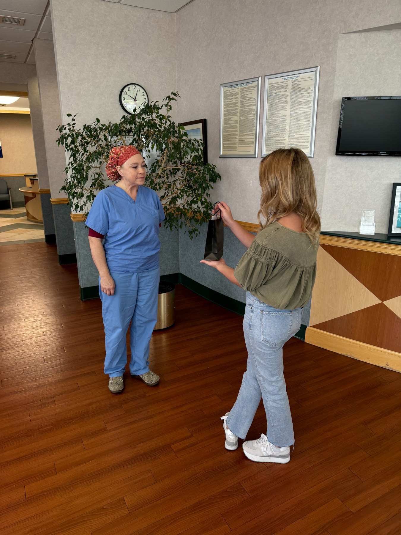 A Helping the Hardworking recognition moment with a nurse in Frankfort